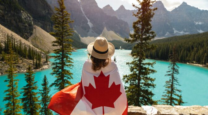woman draped in a flag of canada